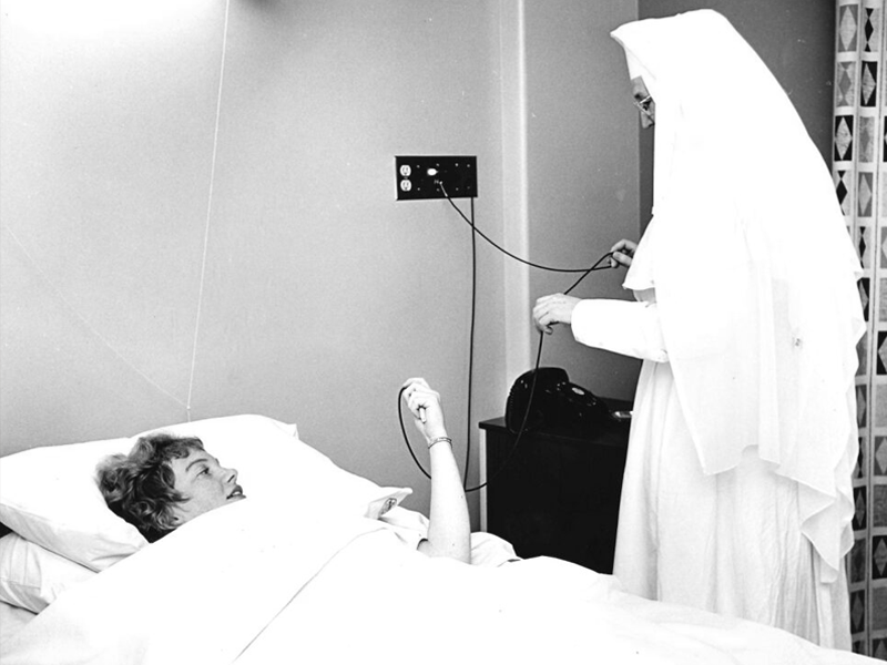 Sister with St. Mary's patient - SMGH Archives